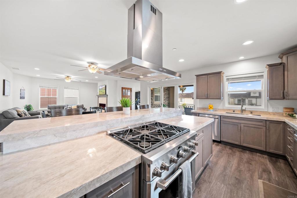 Wonderful open layout with gourmet kitchen, high-end appliances and superior quality materials throughout. Huge outdoor patio space that opens up through large folding glass doors from kitchen and dining room. Ocean breezes with brilliant sunsets will have one feeling like they're on a permanent vacation. Get some sun and soak in the spa on the 2,000+sq ft, panoramic ocean view roof top deck. Only 3 units in building. Walk to the beach, stroll downtown Oceanside's happening venues and vibrant scene. Extremely walkable!