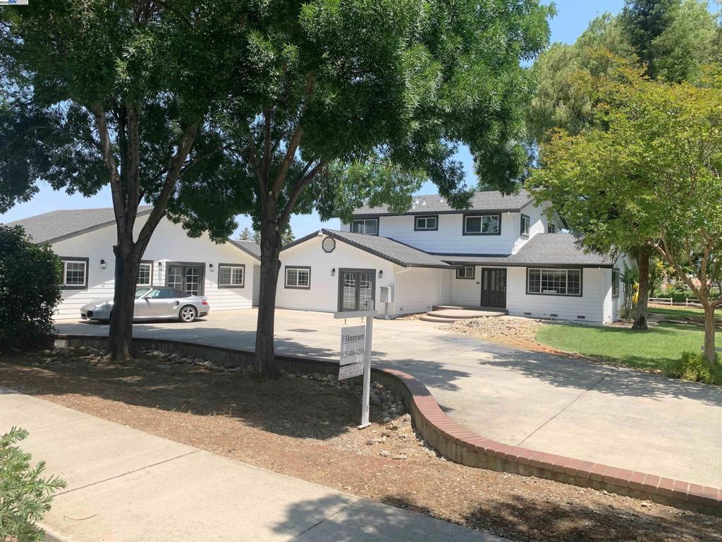 Completely remodeled with high-end materials throughout. Brand-new stainless steel kitchen and appliances, plus custom cabinetry and modern finishes. Extensive crown and base moulding give the home a refined, upscale look. Zoned for both residential and commercial use—ideal for a day care, real estate office, or private residence. A detached 1,100 sq ft building adds flexibility for office, studio, or rental income potential. Situated on over an acre, offering ample space for parking, outdoor use, or future development. Move-in ready with exceptional attention to detail. Rare opportunity to own a beautifully updated property with dual-use potential and land to expand.