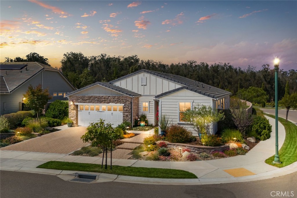 Welcome to 1160 Korey Court, located in the stunning Trilogy at Monarch Dunes in Nipomo, CA. This modern 2-bedroom, 2-bathroom + den home offers 1,724 square feet of exquisite living space on an expansive 8,180 square foot lot. Built in 2017, this residence blends casual elegance with comfort, perfect for todays lifestyle.
Inside, beautiful wood floors guide you through an open layout, highlighted by extended kitchen cabinetry in crisp white, providing ample storage and modern flair. The den features elegant glass doors, offering versatility for your personal needs.
The primary bedroom is a peaceful retreat with a sliding glass door leading to a backyard haven filled with vibrant plants and flowers. Enjoy relaxing on the covered patio with a cozy fireplace and tranquil fountain, an ideal setting for outdoor enjoyment.
Residents of Trilogy at Monarch Dunes enjoy unparalleled amenities, including championship golf, tennis, pickleball, fitness centers, indoor/outdoor pools, fine dining, and a curated calendar of social events. Whether seeking a full-time residence or a weekend retreat, this home offers tranquility, elegance, and an elevated lifestyle.
Experience the best of modern living at 1160 Korey Court, where every detail enhances your lifestyle. Dont miss the chance to make this exceptional property your new home!