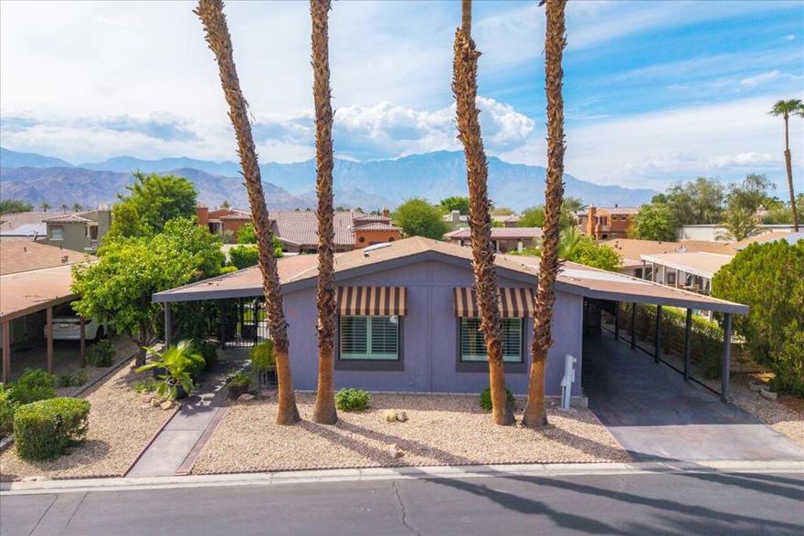 This inviting 1440 sq ft home has been thoughtfully updated over the years with comfort and practicality in mind. Enjoy the timeless appeal of granite countertops and easy-care tile floors, with newer light fixtures adding a fresh touch. Recently, a top-of-the-line $21,000 LENNOX HVAC system, including some new vents, was added to keep temperatures just right all year long. The kitchen features a new dishwasher, and the guest bathroom has a new toilet. Many windows are fitted with plantation shutters, which help keep the home cool during our desert summers and warm in winter, not to mention their elegant appearance and easy maintenance. The great room's skylight brings cheerful natural light into the heart of the home, making gatherings and quiet afternoons equally pleasant. Start the day with coffee or wind down with a cocktail on your private patio, designed for peaceful moments or friendly chats with neighbors. An investment of $5,000 in professional landscaping which includes artificial grass and a sprinkler system, means the side yard is both beautiful and low-maintenance, offering green views without extra hassle. The spacious primary suite features a walk-in closet and convenient slider to the patio for easy outdoor access. There is a storage room with a sink and an AC unit, perfect for your storage needs. This home comes complete with all appliances, including a washer and a dryer, so settling in is truly easy. Each thoughtful upgrade was chosen to enhance daily comfort, making this a welcoming and practical choice for those who value both quality and simplicity in their next chapter.