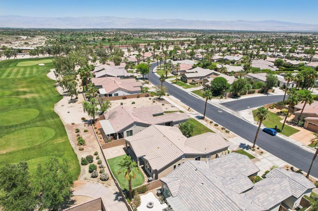 This Unfurnished Property is offered on a long-term annual lease. Presenting the highly sought-after Monterey floor plan, this beautifully appointed single-family residence is ideally situated adjacent to the 8th tee box of The Golf Club at La Quinta. Offering 1,693 square feet of refined living space, the home features two bedrooms, two bathrooms, and a versatile den/office that can serve as a third bedroom. Tile flooring, recessed lighting, a media niche, custom window treatments, and an abundance of natural light enhance the open-concept great room. The chef's kitchen is equipped with stainless steel appliances, including a built-in double oven, a gas cooktop, a microwave, a dishwasher, a newer refrigerator, a pantry, and a prep island with bar seating. The spacious primary suite features a bay window, an en-suite bath with dual vanities, a large shower enclosure, and a generous walk-in closet. The guest bedroom offers privacy and access to a nearby full bath. Additional highlights include an interior laundry room with a newer washer/dryer included.