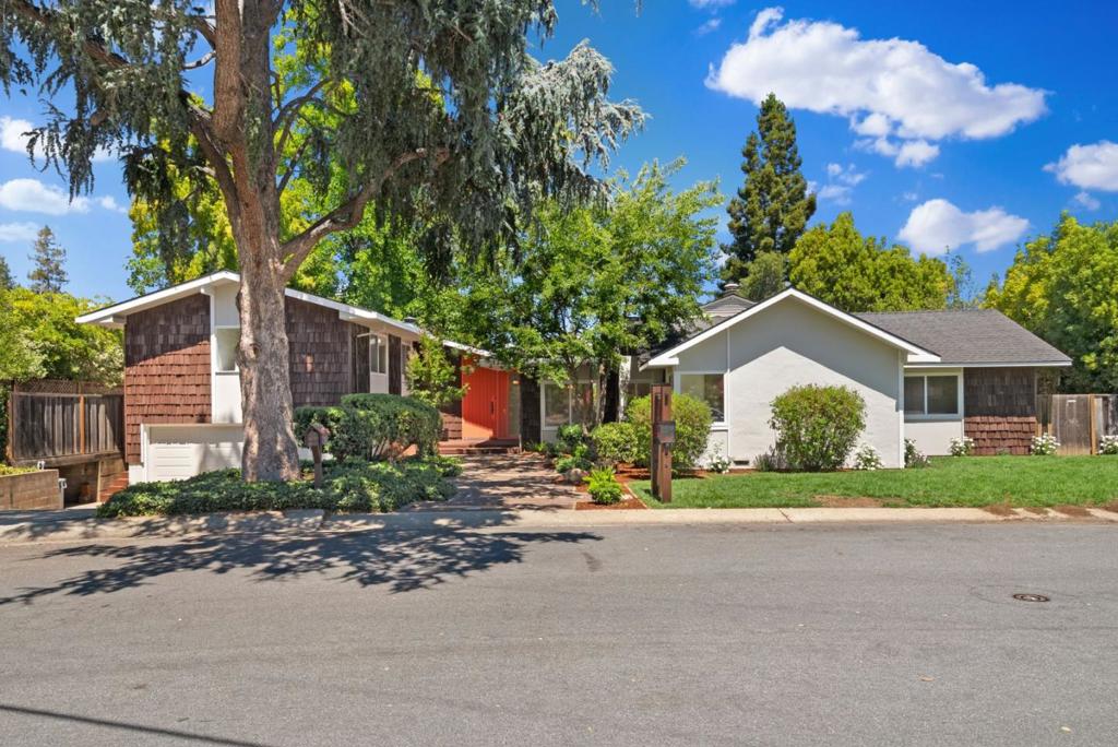 An extraordinary home nestled in the North of Los Altos, this home offers luxury living with its seamless fusion of elegance, meticulous design, and unparalleled accessibility. Perfectly situated for commuters, it caters to discerning buyers who appreciate both sophistication and convenience.This distinguished home boasts two primary suites, generously-sized bedrooms, and a study retreat with a wood-burning fireplace. The grand living room features soaring ceilings, there is a formal dining room and expansive family room graced with vaulted ceilings and floor-to-ceiling windows that invite an abundance of natural light. The lushly landscaped grounds evoke the ambiance of a private resort, complete with a shimmering pool and spa, a classic diving board. Every day feels like a vacation in this serene oasis. Positioned within one of the Bay Area's most prestigious neighborhoods, this residence offers proximity to renowned top-rated schools and the charm and convenience of downtown Los Altos. For those in pursuit of an extraordinary lifestyle at the epicenter of it all, this home extends an invitation to an unparalleled living experience.