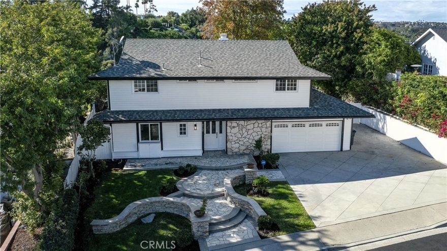 Turnkey Laguna Niguel single-family home with 4 bedrooms, 3.5 bathrooms, and 2,063 sq ft on a 13,926 sq ft lot. Open-concept main level with dual primary bedrooms, one opening to an oversized view deck with stairs leading to the yard and spa. Chef’s kitchen features quartz waterfall countertops, soft-close white cabinets with gold hardware, and new Samsung gas range. Interiors shine with luxury vinyl plank flooring, gas fireplace, decorative wood paneling, and abundant natural light. Outdoors, enjoy private jacuzzi, an oversized view deck with yard access, RV/boat parking, and mature landscaping. Minutes from South OC beaches, Dana Point Harbor, and Laguna Niguel Community Center. Rare dual-primary layout with views—perfect for multigenerational living, families, or empty nesters seeking privacy and turnkey living. This lot is PRIVATE and Quiet and optimal for adding an ADU or enlarging the main level. No streets are visible from the yard and noise levels are minimal and the lot elevation optimizes the views and breezes.  This home is not only remodeled but the main components such as roof, HVAC, ducting, electrical panel, water heater are in newer condition to provide peace of mind. Low tax rate, No HOA and no Mello Roos.