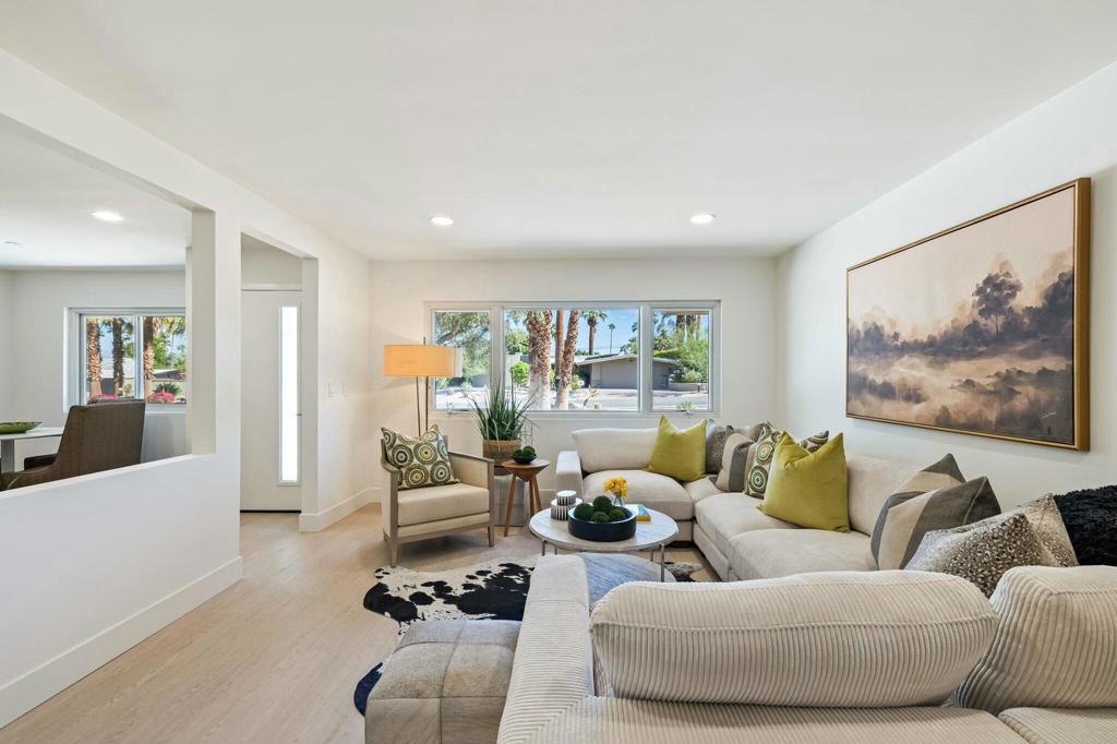 Price reduced by over $400,000 from the original listing--what a deal for this beautifully renovated home!Welcome to this spacious 2,499 sq ft property, ideally located within walking distance from El Paseo. Thoughtfully remodeled from top to bottom, this 4-bedroom, 3-bathroom home sits on an expansive 13,939 sq ft lot and blends modern design with everyday comfort. Inside, you'll find an open-concept layout that's both stylish and functional. Luxury vinyl plank flooring and recessed lighting run throughout the home, creating a clean, contemporary feel. The upgraded kitchen is a standout, complete with stainless steel appliances, quartz countertops, and sleek cabinetry--perfect for any home chef. The oversized primary suite offers a peaceful retreat, featuring a sitting area and a fully updated en-suite with a large shower and dual vanities. A separate family room with a built-in bar opens to the backyard, where stunning south- and west-facing mountain views steal the show. The outdoor space is made for entertaining, with a sparkling pool and spa surrounded by plenty of room to relax or host guests. Other features include a two-car garage and an in-home laundry for convenience. This home isn't just move-in ready--it's a lifestyle upgrade. Come see for yourself and imagine making it yours!
