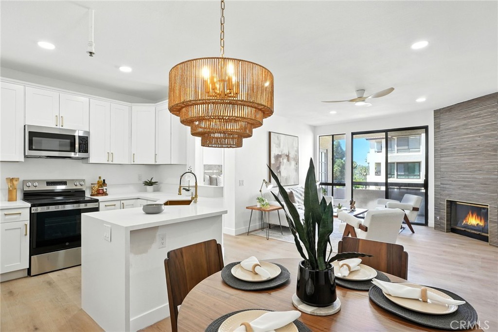5875 Friars Rd #4314 in San Diego is a newly remodeled two-bedroom, two-bath condominium located in the highly desirable Courtyards community in Mission Valley. Positioned on the fourth floor, this residence offers a perfect balance of privacy and convenience with resort-style amenities at your doorstep. The interior has been thoughtfully updated with new luxury flooring, fresh paint, plush carpet, and modern finishes throughout. High ceilings, recessed lighting, and expansive windows fill the home with natural light while showcasing serene panoramic views. The kitchen is appointed with quartz countertops, updated cabinetry, and stainless steel appliances, while the living room centers around a marble-surround fireplace. The spacious primary suite includes a walk-in closet, a second closet, and a spa-inspired bathroom with a soaking tub. A large covered balcony overlooks tranquil ponds and fountains, creating a relaxing retreat. Additional highlights include renovated bathrooms with designer upgrades and in-unit laundry for everyday convenience. The Courtyards community provides an unmatched lifestyle with multiple pools, spa, sauna, fitness center, tennis courts, a large dog park, and meticulously landscaped grounds with calming water features. Residents also benefit from two designated garage parking spaces, 24-hour security, a gated entry with a guard, and on-site maintenance services. Ideally situated near USD, Fashion Valley Mall, Old Town, Downtown San Diego, beaches, and major freeways, this home offers exceptional access to shopping, dining, recreation, and entertainment. Move-in ready and meticulously maintained, this property combines contemporary design, resort-style living, and an unbeatable Mission Valley location.