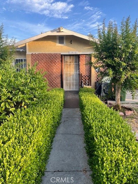 Photo of 1418 W 70th Street, Los Angeles, CA 90047 (MLS # DW25130429)
