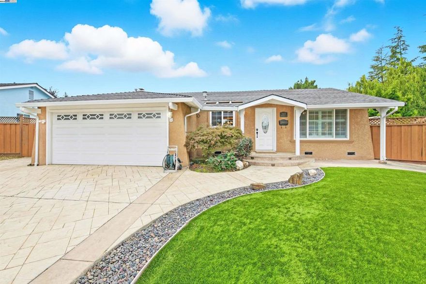 Tucked into a charming cul-de-sac in the sought-after Northgate neighborhood, this beautiful single-story home offers the ideal blend of comfort, privacy, and modern upgrades. The thoughtfully customized floor plan features open living areas and a seamless flow between rooms, creating a welcoming and functional space for everyday living. The expanded living room showcases luxurious cathedral ceilings with skylights, a built-in office nook, and a custom wet bar. Notable upgrades include owned solar panels (under Net Energy Metering 2.0), stylish herringbone LVP flooring, new carpeting, freshly painted interiors and energy-efficient dual-pane windows. The kitchen features granite countertops, custom oak cabinetry, new fridge and tile flooring. Step into the spacious backyard with a wood lattice pergola, sprawling lawn area, storage shed and RV side access—perfect for entertaining, gardening or extra parking. This generous lot also has potential for future expansion or ADU. Ideally located near excellent schools and within walking distance to parks, shopping centers, and Alameda Creek Trail. A commuter’s dream with easy access to 880, Dumbarton Bridge, BART, and Centerville Train Station. Don’t miss this rare opportunity in the Northgate neighborhood—this home is a must-see!