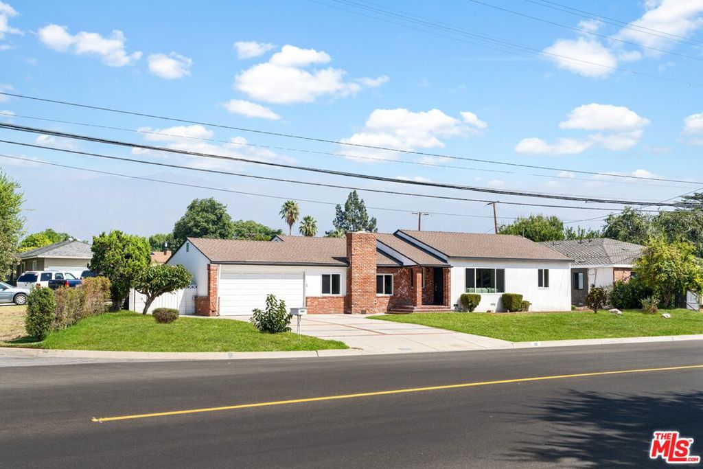 Tucked away in the prestigious Arcadia neighborhood, this beautifully reimagined home captures the essence of comfortable living while embracing modern updates. Originally built in 1947 and thoughtfully refreshed in 2025, this home features 4-bedroom, 3 and a half bathroom, offering 2,871 SqFt living space on a spacious 12,112 SqFt lot. The moment you step inside, sunlight streams through larger windows creating an airy, welcoming atmosphere. The open-concept floor plan seamlessly flows living room, family room, kitchen, and the dinning area. The kitchen is a showstopper, blending function and beauty with its expansive counter space, custom cabinetry, granite countertops, and stainless steel appliances. There is a walk-in pantry as well providing ample storage space. The primary bedroom, nestled at the back of the house for added privacy, features a luxurious en suite bath with a dual vanity, a spacious shower, and a relaxing bathtub. Step outside to a sparkling pool, a versatile shed, and a bonus room, offering endless possibilities for relaxation or entertainment. An attached two-car garage, along with wide front driveways, offers plenty of parking space. This move-in ready home boasts brand-new flooring, new windows, smooth ceilings with recessed lighting, and fresh paint throughout. Located within excellent top rated Arcadia School District and perfectly situated near shopping mall, racetrack, and golf course, don t miss the chance to see this spacious home in person.