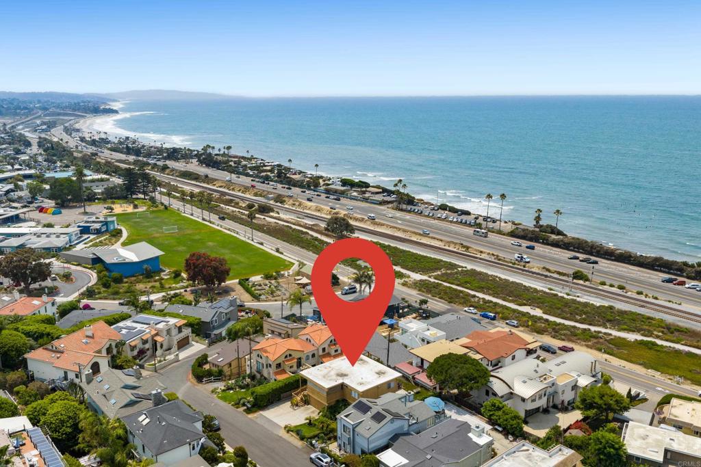 Nestled on one of Cardiff's most coveted streets with sweeping ocean views perched above and away from the traffic and road noise, Haydn Drive is extremely special. This property offers excellent flexibility to reimagine it entirely--take it down to 50% of the walls and call it a "remodel" to build your dream home, or develop a luxury duplex, or hold as a long-term investment. Situated just atop the coast highway and Cardiff's rail trail, the location simply cannot be beat. The existing property sits on a 7,272 square foot lot and is currently configured as a "stacked" duplex. Top unit is configured as a 2 bed and 2 bath while the lower unit is configured as a 2 bedroom and one bath. Walk to beaches, restaurants, the locally famous Seaside Market, award-winning schools and enjoy the ultimate coastal lifestyle. Don't miss this legacy opportunity in one of North County's most desirable enclaves.