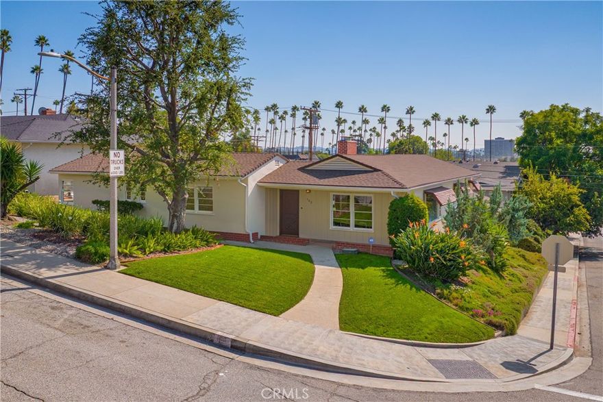Charming middle-century single-story Traditional on a spacious corner lot at the top of Brand Blvd on the border of Rossmoyne and Northwest Glendale. The functional L-shaped floorplan features two wings. The western wing has a generous open floor plan Living/Dining Room space that has amazing large windows that let in lots of natural light and is anchored by an original stone fireplace with mahogany mantle and built in bookshelf. Also at this end of the house are the restored vintage Kitchen that has recently refinished solid wood cabinets, an eat-in nook and newer stainless appliances as well as the home's Laundry Room, access to the back patio and the second Bathroom, this one with a stall shower. The east wing contains both of the home's Bedrooms which are separated by the main full Bathroom. The main level of the house opens to the spacious back patio through four different doors, creating a fabulous CA indoor/outdoor lifestyle. Below the Kitchen and entered through a door off the driveway is an add'l 200 SF Studio/Office/Gym with a half Bathroom. The home's 2-car Garage was converted to 454 SF bonus living space by a previous owner and also has a half Bathroom. There is Central HVAC (except in the converted Garage), copper plumbing, mostly ABS waste lines, 125 AMP electrical panel, water tight roof, and original seismic bolting. A large asphalt pad offers plenty of off-street parking and a handy shed offers additional storage. Close to the charming shops and dining along North Brand Blvd including Trader Joes, Starbucks, religious services, Equinox gym as well as quick access to the 2, 5 and 134 Fwys.