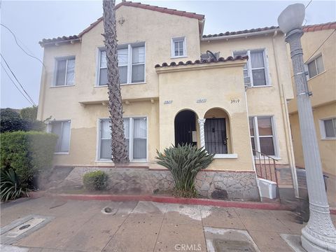 Photo of 3921 Walton Avenue, Los Angeles, CA 90037 (MLS # SB25277927)