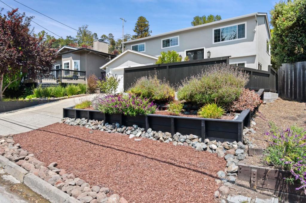 Beautifully remodeled home with thoughtful updates throughout, including energy-efficient windows, custom trim, bamboo floors, recessed lighting, new stucco, and fresh paint. The spacious kitchen showcases custom cabinetry, KitchenAid appliances, marble backsplash, and an RO water system. Both bathrooms feature premium tile, custom vanities, an extra-deep Kohler tub up and marble shower surround down. Enjoy the welcoming layout with easy flow between rooms, and a living room with electric fireplace, perfect for relaxing. Take in ocean views, including Mavericks surf break, from the living room and two upstairs bedrooms. Downstairs are two additional bedrooms, a full bath, and a large family room opening to the back patio - ideal for stretching out or entertaining. Built-ins, a refinished staircase, and a finished garage with enclosed laundry add comfort and function. The backyard includes erosion control, custom drainage, and potential for a separate ADU. Just a 5-minute walk to Surfers Beach and Sams Chowder House, with quick access to Pillar Point Harbor and Quarry Park trails. Lovingly maintained and move-in ready, this is coastal living at its finest.