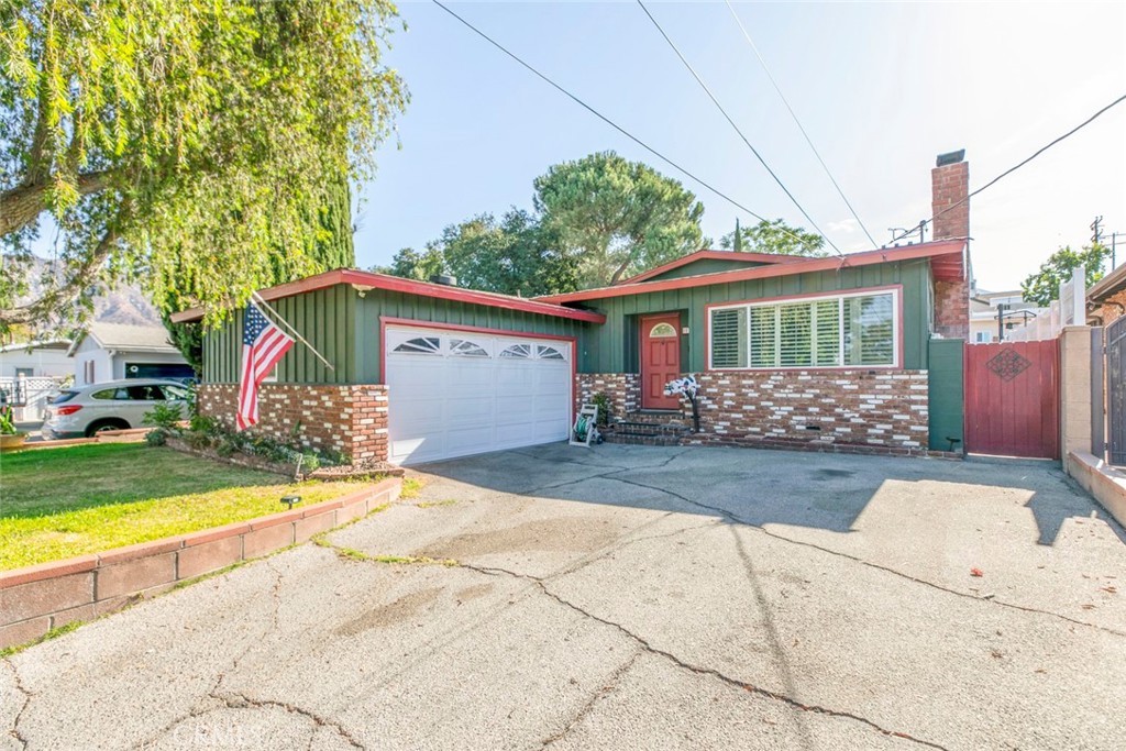 This beautifully maintained 3 bedroom, 2 bathroom home in Sunland, CA offers 1,161 sq. ft. of inviting living space, perfect for families or anyone seeking comfort and convenience. The open and bright layout creates a warm atmosphere, while the functional kitchen flows seamlessly into the dining and living areas, making it ideal for daily living and entertaining. An attached garage provides secure parking and extra storage, and the included washer and dryer add everyday convenience. Step outside to enjoy a spacious private backyard, perfect for outdoor gatherings, gardening, or simply relaxing in your own space. Situated in a quiet residential neighborhood, this home offers easy access to local schools, shopping, dining, hiking trails, and major freeways, giving you both a peaceful retreat and quick connections to everything Los Angeles has to offer.