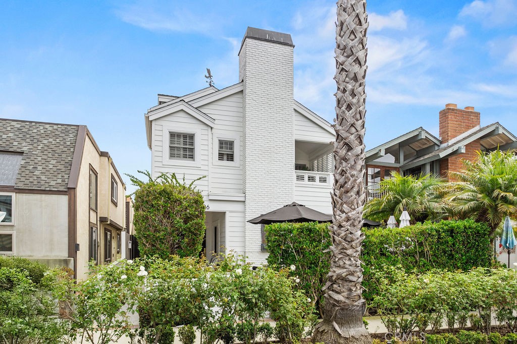 Sun-drenched and full of charm, this rear unit is just steps from village shopping and dining, and a short stroll across the Goldenrod Footbridge to the sand. Featuring two bedrooms and two bathrooms, including a primary with ensuite bath, the home boasts soaring high ceilings, abundant natural light, and fresh new flooring throughout. A brand-new split A/C in the living room keeps things cool, while remote-controlled ceiling fans in the bedrooms ensure comfort year-round. Added conveniences include a single-car garage plus covered carport, washer and dryer, and an extra refrigerator in the garage. Don’t miss your chance to live in the heart of the Village, just minutes from the water and all that Corona del Mar has to offer.