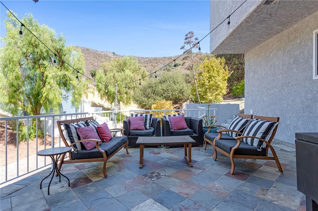 Photo of 20906 Almazan Road, Woodland Hills, CA 91364 (MLS # SB26123952)