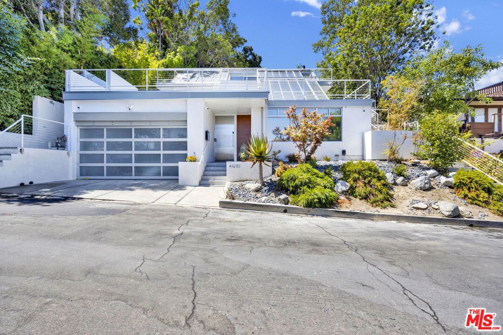 Welcome to a rare opportunity to lease a 3 story architectural home, defined by floor to ceiling skylights that fill the interiors with natural light. The residence features a chef's kitchen with high-end appliances and custom Italian cabinetry. Fleetwood sliding doors open to expansive decks and patio spaces, creating seamless indoor-outdoor living. The private backyard retreat is complete with a putting green and golf practice cage, perfect for relaxation or recreation. An attached bonus shed provides additional versatility as a tool workshop and storage space. This lease is for the main residence only. The detached ADU may be available upon request by the same applicant, but will not be leased separately and will otherwise remain vacant.