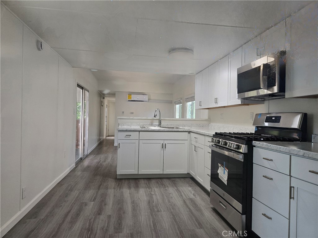 Welcome to your beautifully reimagined home in this quiet and friendly 55+ community! Taken down to the studs and thoughtfully remodeled, this 2-bedroom, 1-bath gem feels brand new with stylish finishes and quality upgrades throughout. Enjoy the comfort of brand-new mini-split heating and cooling units, kitchen appliances, fresh flooring and paint, and a bright, open-concept layout that feels both cozy and modern. The sleek kitchen boasts all-new cabinetry, countertops, and stainless steel appliances – perfect for easy living and relaxing. Every detail has been carefully considered to provide peace of mind and ease of maintenance. Located in a pet-friendly park with reasonable space rent and a welcoming neighborhood vibe, this is low-maintenance living at its best. Move-in ready and worry-free – come see for yourself!