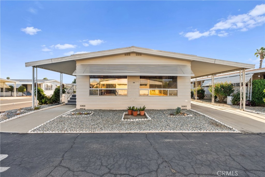 Welcome to 1525 W Oakland Ave #50. A Move-In Ready Gem in the Gated 55+ Community of Eden Roc North! This beautifully maintained home is truly turnkey and ready for its next owner. Step inside to find updates throughout. The spacious interior features new interior and exterior paint, new carpet, new laminate flooring in both bathrooms, new ceiling fans and new toilets. The gorgeous kitchen has wood cabinetry & elegant countertops, stainless steel stove and dishwasher, new faucet and new garbage disposal. Enjoy your morning coffee or evening breeze on the large front patio with fresh carpet, and take advantage of the generous covered carport with a convenient storage shed. Eden Roc North is a clean, quiet, and friendly senior community that is meticulously maintained. You’ll love the central location just minutes from the Hemet Valley Mall, Hemet Global Medical Center, Walmart Neighborhood Market, Target, Hemet DMV, the Social Security Office, and a variety of popular restaurants and shops.