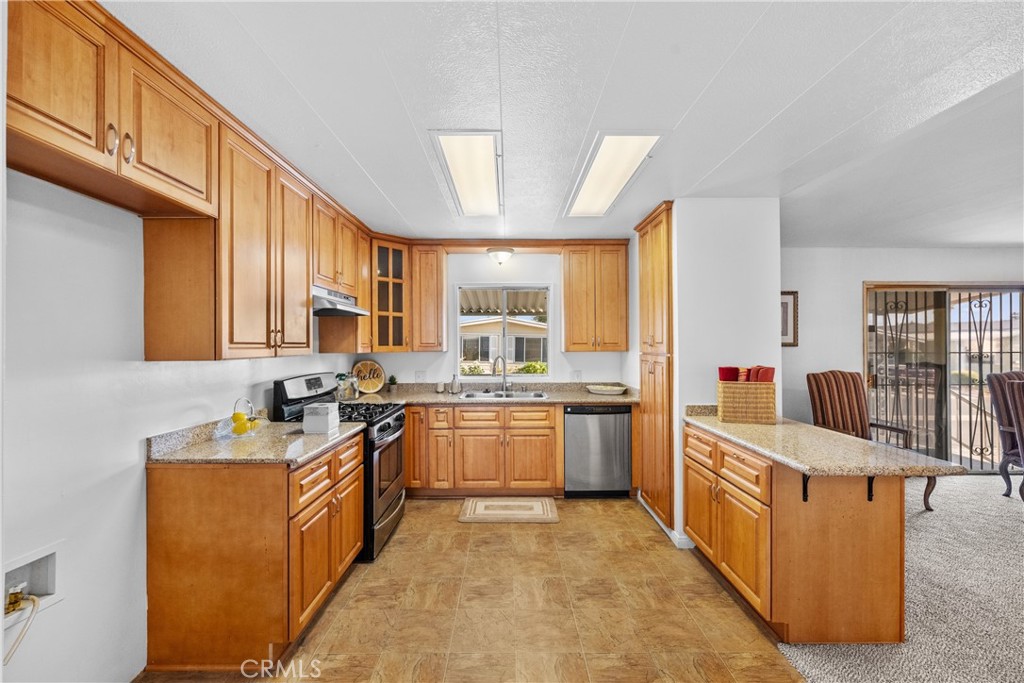 Welcome to 1525 W Oakland Ave #50. A Move-In Ready Gem in the Gated 55+ Community of Eden Roc North! This beautifully maintained home is truly turnkey and ready for its next owner. Step inside to find updates throughout. The spacious interior features new interior and exterior paint, new carpet, new laminate flooring in both bathrooms, new ceiling fans and new toilets. The gorgeous kitchen has wood cabinetry & elegant countertops, stainless steel stove and dishwasher, new faucet and new garbage disposal. Enjoy your morning coffee or evening breeze on the large front patio with fresh carpet, and take advantage of the generous covered carport with a convenient storage shed. Eden Roc North is a clean, quiet, and friendly senior community that is meticulously maintained. You’ll love the central location just minutes from the Hemet Valley Mall, Hemet Global Medical Center, Walmart Neighborhood Market, Target, Hemet DMV, the Social Security Office, and a variety of popular restaurants and shops.