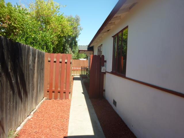 This lovely back unit of a duplex is bright, spacious and so charming! Features a large eat in kitchen, full size washer and dryer, laminate floors through out. It has double pane windows, ceiling fans and a wall heater. It has a large backyard and a detached 1 car garage. Available now for immediate occupancy.