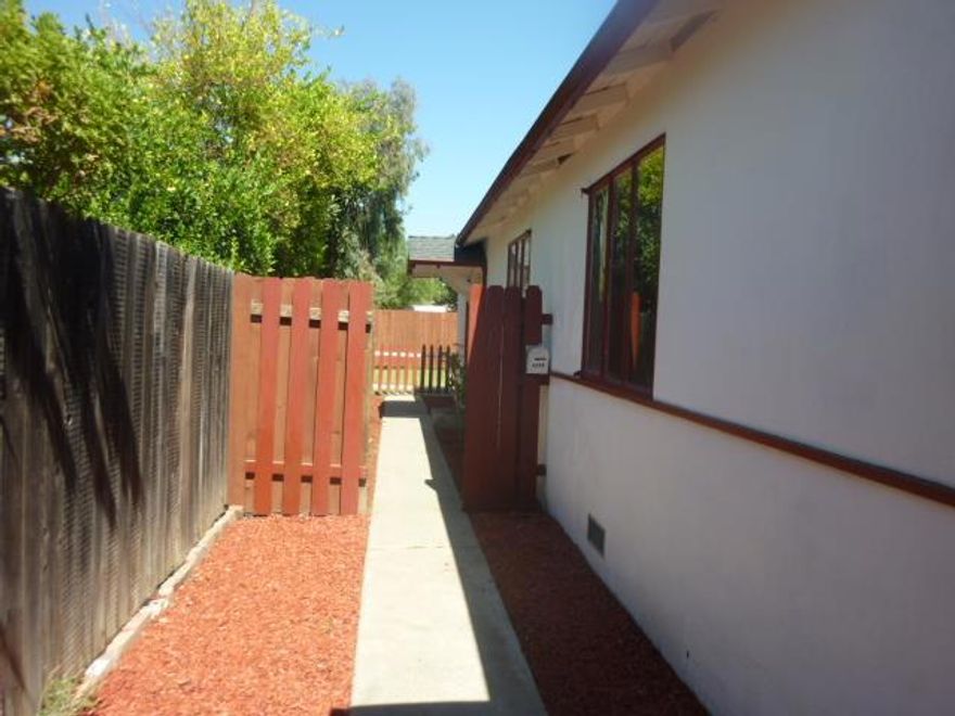 This lovely back unit of a duplex is bright, spacious and so charming! Features a large eat in kitchen, full size washer and dryer, laminate floors through out. It has double pane windows, ceiling fans and a wall heater. It has a large backyard and a detached 1 car garage. Available now for immediate occupancy.