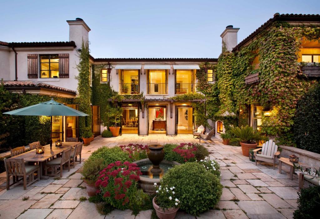 Perfectly set in one of the most desirable areas of Central Woodside at the end of a private, quiet cul-de-sac within easy walking distance to Town and the acclaimed Woodside School, this elegant estate's fully landscaped 3.0 acres features a contemporary Walker Warner-designed Tuscan-influenced 6,035+/- sq ft main home with a gracious combination of refined interior finishes, flowing two-story floor plan and beautiful architectural integrity. In addition to the main home, the compound includes a unique 700 +/- sq ft cottage just below a world-class tennis court, a detached 845+/- sq ft 1 BR guest house and an 875+/- sq ft 1 BR pool house and workout room adjacent to a large solar heated custom pool, spa and entertaining patio all nestled in a mature grove of olive trees. Energy efficiency includes photovoltaic solar panels driving the 5-zone air conditioning, a geothermal heating system, tankless water heaters and a full back-up generator for the property.