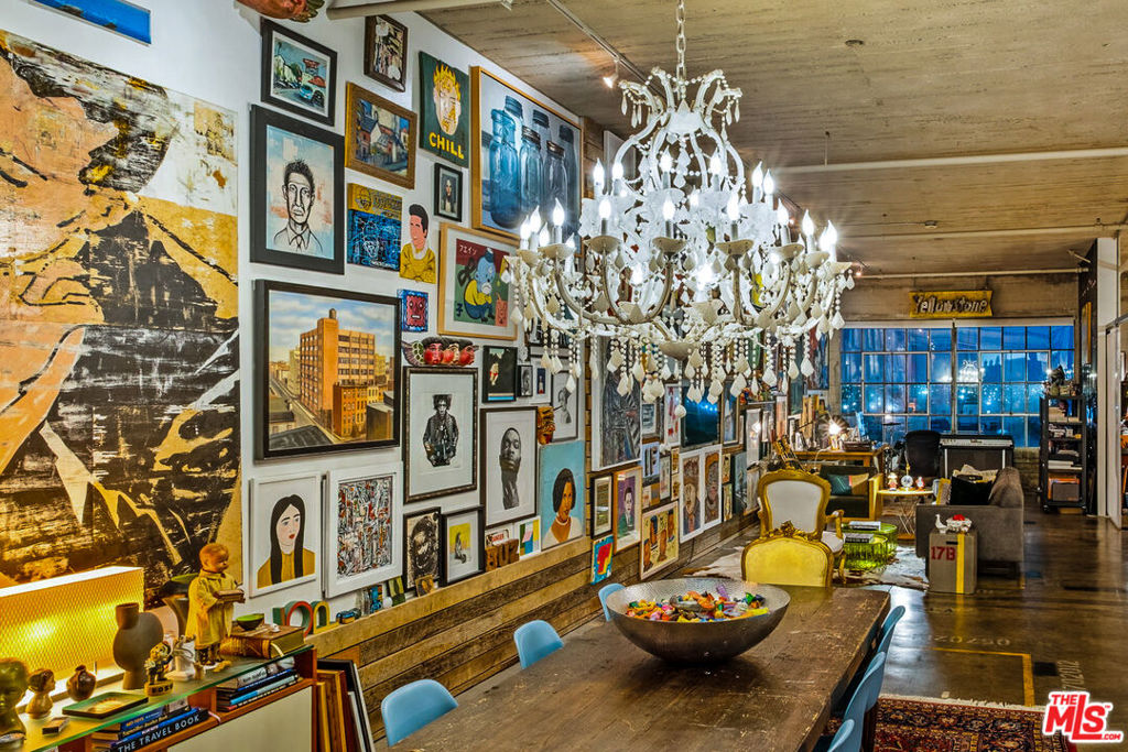 A master class in curated energetic space, this top floor, south facing loft in the historic Toy Factory building offers the quintessential Arts District experience. As featured on the cover of DTLA News' "Art of the Loft" article, nearly 1,500 square feet of open concept living showcase the muscular, original elements of the 100-year-old manufacturing plant: expansive original steel factory windows, concrete pillars, polished concrete aggregate floors, exposed ducting, and massive volumetric spaces. An ideal residence for artists, collectors, musicians, and other creative souls, with endless expanses of gallery/display and work space. Extensive custom hidden storage, a 2 ft. raised bedroom zone with a fleet of deep roll-out drawers, full bath with dual vanities, laundry inside the unit, and a flexible den or office (possible second bedroom) with custom pocket doors complete the space. The HOA features a rooftop pool just one level above the unit, with dramatic skyline views and a fire pit lounge, and a community garden space. Additional perqs of this offering include controlled access, fully outfitted on-site gym and one dedicated parking spot (plus ample public parking across the street), conveniences that let you relax, entertain friends and family, and enjoy your home. HOA dues are $965/month and include a doorman, water, trash, sewer, and building amenities. The lively Flamingo Bar and a bodega/convenience shop located on the first floor provide food, drink, and sundries at your fingertips. And close by, great dining from Camelia restaurant to Bestia, Urth, Girl and the Goat, Bavel, and more, plus shopping and neighborhood landmarks, including the forthcoming Sixth Street PARC - 12 acres of green space, art installations, and gathering areas along the LA River. Not to be missed!