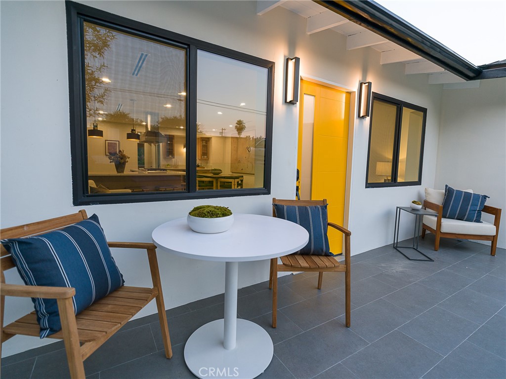 Welcome to 4925 Buchanan Street, an exquisitely remodeled and fully reimagined home in the heart of Highland Park, offering a rare blend of modern luxury, thoughtful design, and unbeatable location. This beautifully updated residence features 3 spacious bedrooms, 2 full bathrooms, and 1,698 square feet of elegant living space, along with a large bonus room complete with a walk-in closet—perfect for a fourth bedroom, office, playroom, or guest suite. Situated on a generous 5,398 square foot lot, the home showcases hillside and neighborhood views from the primary bedroom and is just two blocks south of the iconic York Boulevard, placing you within easy walking distance to Highland Park’s trendiest restaurants, vibrant coffee shops, boutique shopping, and popular green spaces. Step inside to discover an open-concept layout that seamlessly connects the living, dining, and kitchen areas—ideal for entertaining and everyday living. The interior is adorned with brand-new wide-plank flooring, fresh interior paint, and abundant natural light. A sleek electric fireplace serves as the focal point of the living room, adding warmth and style. The fully renovated kitchen is a chef’s dream, featuring all-new high-end appliances including a refrigerator, gas range, oven, in-drawer microwave, dishwasher, and garbage disposal. Quartz countertops, custom cabinetry, and recessed in-ceiling lighting provide a modern yet inviting aesthetic. Both bathrooms have been completely remodeled with tasteful, contemporary finishes. Every door in the home is new, and the property is equipped with in-unit laundry for ultimate convenience. The exterior has been transformed with new flat stucco, a new roof, fresh paint, a landscaped front yard with new steps, and modern front yard gates. An automatic front gate opens to a long multi-car driveway, providing secure off-street parking. The detached 1-car garage has been converted into a fully finished office or creative flex space, complete with new sliding glass doors and its own mini-split HVAC system for year-round comfort. The backyard is a private retreat, designed for both relaxation and entertaining, with new landscaping, a spacious patio, a stylish 8-foot stock tank pool, and trendy string lights that create a magical nighttime ambiance. This turnkey home in one of L.A.’s most desirable neighborhoods is a must-see!