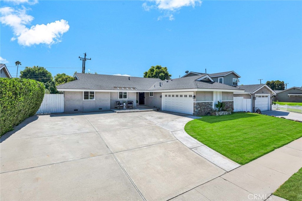 Welcome to 12872 Woodlawn Avenue, a Move In Ready Dream Home Located on an Interior Lot in the Heart of Tustin. This Single Level Home Showcases an Open Floor Plan with Four Bedrooms, Two Full Bathrooms, Luxury Vinyl Plank Floors, Newer Exterior Paint, and Dual Pane Windows. The Living Room Enjoys a Stone Fireplace, Backyard Access, and Overlooks the Dining Room/Kitchen. The Light & Bright Kitchen Includes Granite Counters, Peninsula with Seating, Stainless Steel Appliances, Backyard Views, and Opens to the Dining Area with Backyard Access. The Primary Bedroom Features Backyard Access, Two Closets, and an En-Suite Bath with Walk-In Shower. The Spacious Wraparound Backyard Features a Large Grass Area, Firepit, Lush Landscaping, Multiple Seating Areas, and Large Side Yard with a Covered Patio. Direct Access Two Car Garage with Built-In Cabinets. No HOA or Mello Roos! This Convenient Location is Walking Distance to Trader Joe's, Aldi, Restaurants, and a Short Drive to Old Town Tustin, Tustin Ranch Golf Course, Multiple Parks, and Award Winning Schools. Easy Access to the 5/55/22 Freeways and 241/261 Toll Roads. 12872 Woodlawn Avenue is a Must See!