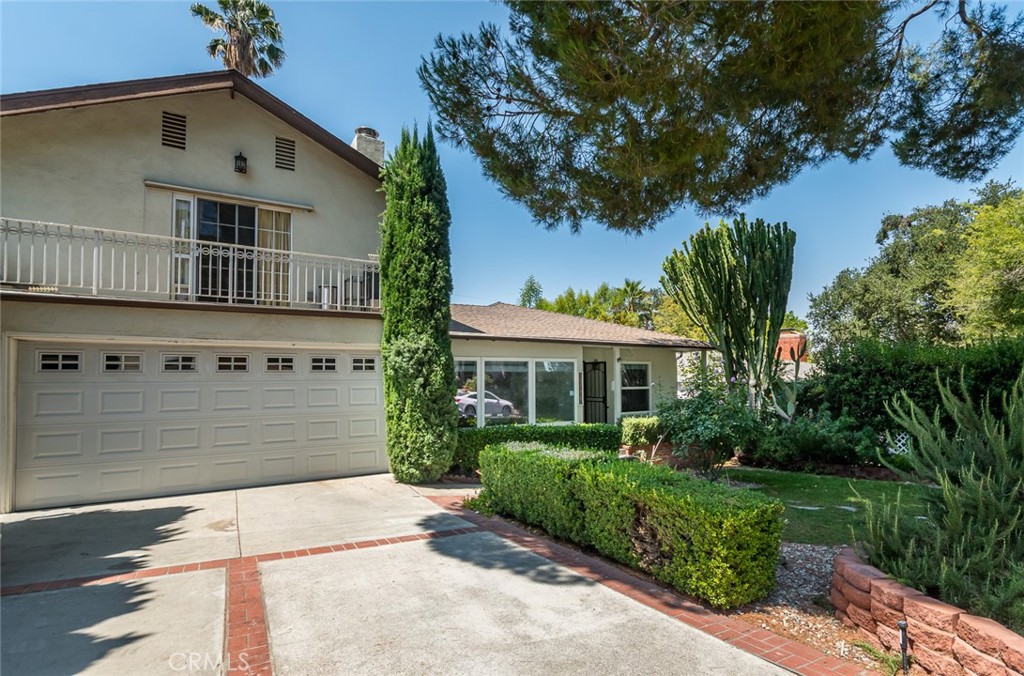 Nestled in a tucked away Sunland neighborhood, this 3-bedroom, 3-bath home features warm wood floors, a spacious upstairs primary suite with a cozy office, and inviting indoor-outdoor flow. The backyard is perfect for entertaining, with a patio off the dining room and plenty of space to gather. A hidden wine room adds a unique touch for storage or tastings. Central air conditioning as well as Solar power are two additional features of the home. Come see this lovely retreat!
