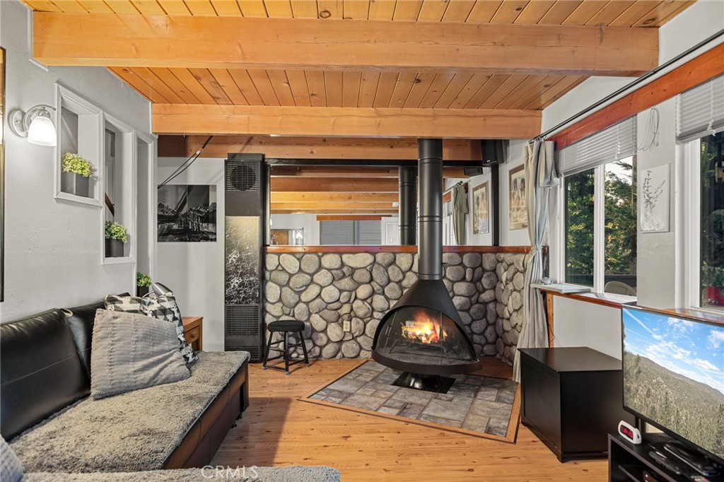 Well maintained home in a quiet neighborhood not far from Snow Valley Ski Resort and not far from the national forest, the perfect base camp for either a part time getaway or full time mountain living. Picturesque fireplace in main living room, open to the kitchen, with a back deck for soaking up time in the trees. Bathroom is on the main floor and up the stairs are two bedrooms. The front porch is perfect for slow mornings and unwinding at the end of a day. Fantastic level parking for added convenience!