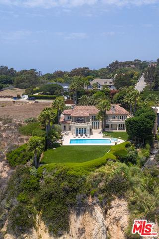 Grand European-style estate with 100' of bluff top panoramic ocean views on prestigious Point Dume. Masterfully re-decorated & sparing no expense in improvements over the past year, this gated/private 2-story, 7 bdrm, 8 bath home w/hardwood & stone flrs throughout is a superb blend of modern elegance & impeccable craftsmanship. With ocean views throughout, the 1st level offers an elegant 2-story entry w/floating staircase; fml living rm w/fireplc & dining rm; gourmet kitchen w/high-end appliances, central island & breakfast nook; cozy family room, gorgeous office w/full bath, & 2-en-suite bdrms. The 2nd level offers a sun-filled owner's suite w/stunning ocean view terrace, luxurious spa-like bath & vast closet; plus 4-addl en-suite ocean view bdrms w/terraces & steam/dry sauna. The apx 1.29 park-like acres w/multiple outdoor dining /sitting areas, BBQ island & pool/spa is perfect for lavish or intimate events. 3-car garage, covered 6-car structure, porte-cochere & ample guest parking.
