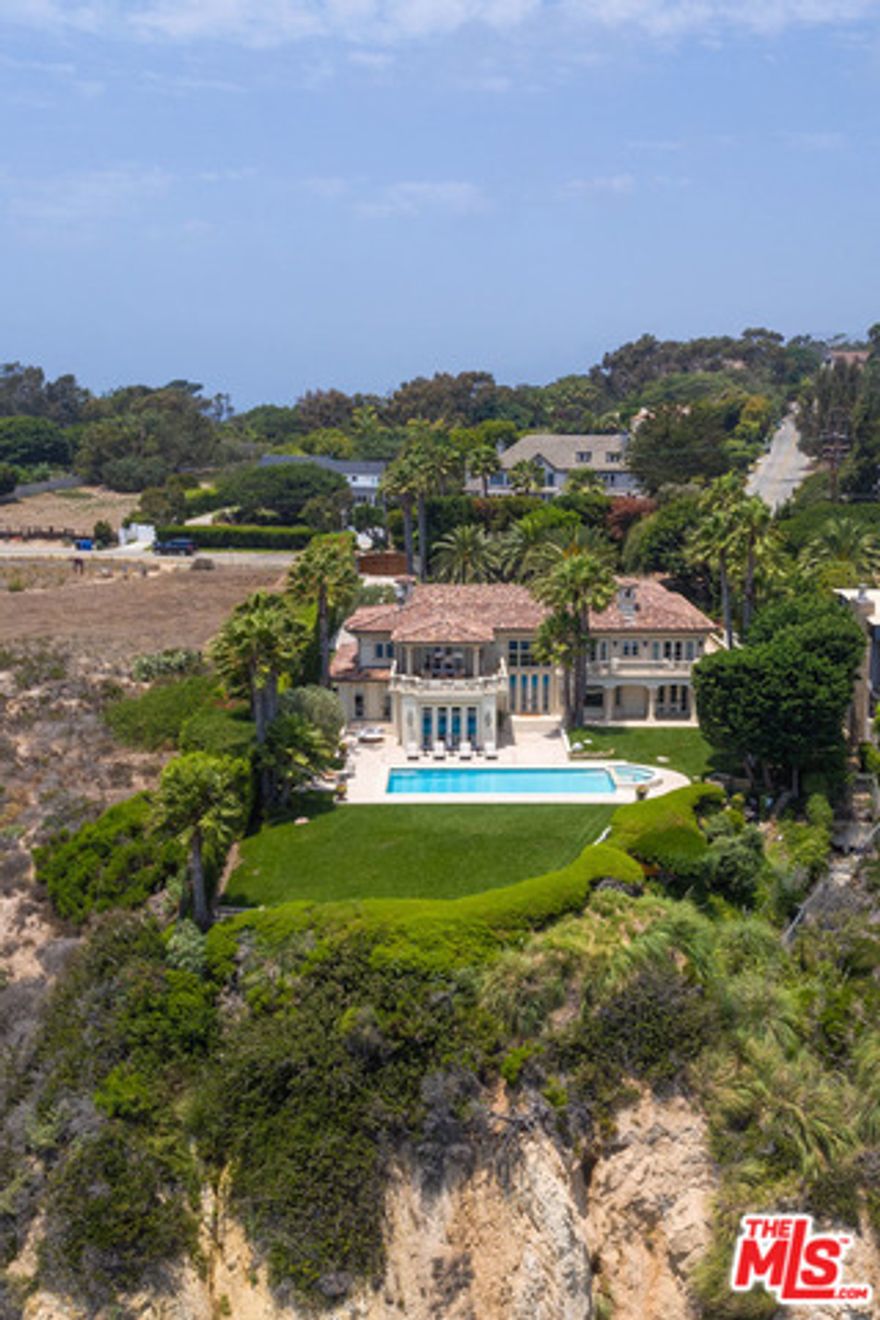 Grand European-style estate with 100' of bluff top panoramic ocean views on prestigious Point Dume. Masterfully re-decorated & sparing no expense in improvements over the past year, this gated/private 2-story, 7 bdrm, 8 bath home w/hardwood & stone flrs throughout is a superb blend of modern elegance & impeccable craftsmanship. With ocean views throughout, the 1st level offers an elegant 2-story entry w/floating staircase; fml living rm w/fireplc & dining rm; gourmet kitchen w/high-end appliances, central island & breakfast nook; cozy family room, gorgeous office w/full bath, & 2-en-suite bdrms. The 2nd level offers a sun-filled owner's suite w/stunning ocean view terrace, luxurious spa-like bath & vast closet; plus 4-addl en-suite ocean view bdrms w/terraces & steam/dry sauna. The apx 1.29 park-like acres w/multiple outdoor dining /sitting areas, BBQ island & pool/spa is perfect for lavish or intimate events. 3-car garage, covered 6-car structure, porte-cochere & ample guest parking.