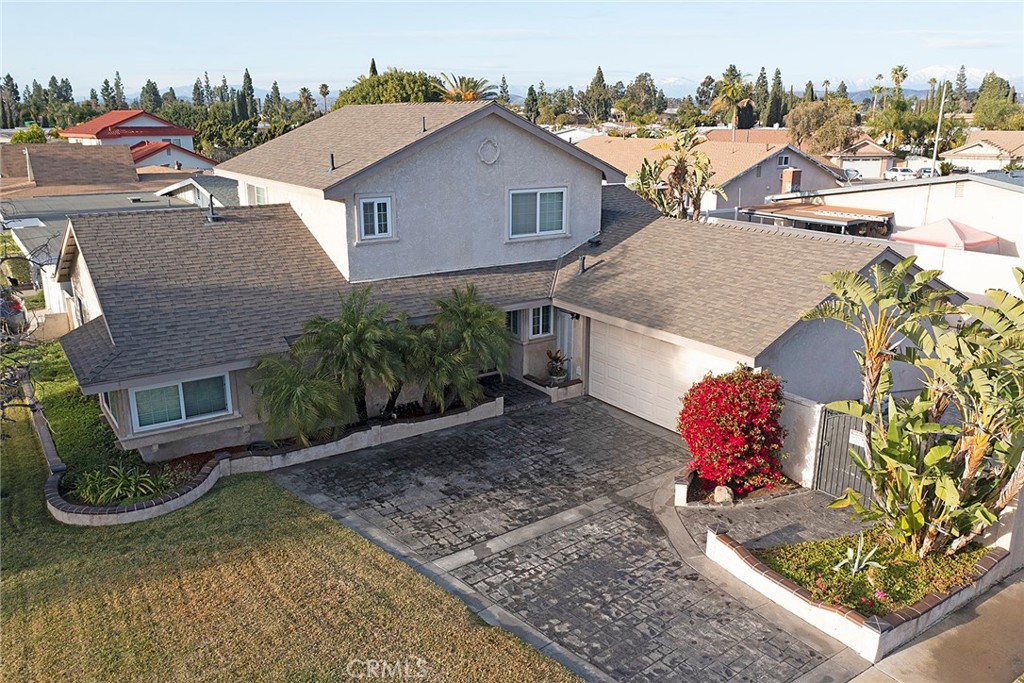 Welcome to this beautifully remodeled East Anaheim two-story family home. Located in a quiet and desirable neighborhood, this extensively upgraded 5bd/2.75ba. home comes with an attached two car garage and hardscaped backyard with pool. The custom kitchen features upgraded cabinetry, granite countertops, and stainless appliances. Upgraded bathrooms feature custom marble stone throughout and designer fixtures. The home also includes new paint and new plank laminate flooring. Cozy fireplace in the large family room makes it a great place to entertain guests or for families to gather. Newer double-paned windows and slider throughout. One of the best features are the larger bedrooms. There is a master bedroom with two good-sized bedrooms on the lower level. Upstairs, there is a large second master bedroom with attached bathroom and an additional oversized bedroom. Two-car garage with shelving and epoxied flooring. This property offers the new residents endless versatility. The front yard is on sprinklers and a gardener and pool maintenance is included. Hurry! Great location and perfectly situated and located near 57/91/55 freeways. Pets are OK with an additional deposit. Monthly pet rent to be $30/cat and $50/dog.