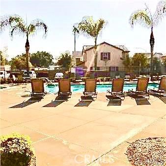 Beautiful La Rivera Villa home in gated community with manicured grounds, playgrounds, pool/spa and club house. Two-story, 3 Bedroom, 3 Bath home with walk-in closets, is located in back north/east corner of gated community, which provides more privacy. Property is centrally located, minutes from UCR and a quick walk to growing urbanized Downtown Riverside. Easy access to freeway on-ramps. Beautiful interior, with open floor plan and 9ft ceilings make the house light and airy. Eat-in Kitchen has beautiful wood cabinets, and house has wood laminate flooring and ceramic tile flooring throughout. Quaint backyard with mature landscaping makes this house a downtown oasis. Attached 2-car garage and whole-house water softener. You must call the listing agent FOR ACCESS TO THE PROPERTY. Do not call office.