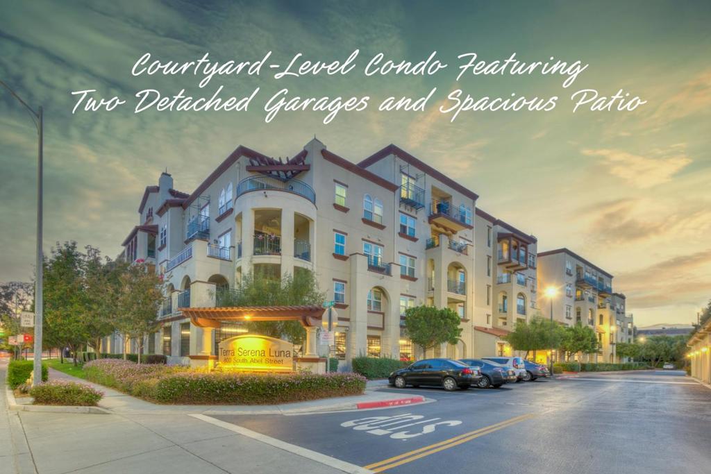 Discover this beautifully upgraded 2-bed, 2-bath, 1,259 sq ft single-level condo, built in 2007 and lovingly maintained by its original owner, located on the serene courtyard level (2nd floor) of the Terra Serena Luna community. No neighbor on one side, the spacious west-facing patio enhanced with lush greenery that offers natural privacy extends your living space and pairs perfectly with the open layout, making it ideal for relaxing, entertaining, and providing a great space for children to play and explore. The spacious primary suite features a walk-in closet, double vanity, soaking tub, and separate shower. Upgrades include stylish engineered hardwood floors, granite kitchen countertops, new carpet, fresh paint, new stainless steel appliances, new energy-efficient LED lights, and new ceiling-mount LED fixtures. Enjoy in-unit laundry, central heat and A/C, two detached private garages, and a nearby exterior storage room. The unit is also just steps from both the elevator and stairs. Community amenities include EV chargers, a clubhouse, gym, pool, jacuzzi, BBQ area, playgrounds, landscaped courtyards, and elevators. HOA dues include water, garbage, and insurance. This condo is within walking distance of the Great Mall, light rail & a nearby park. Some photos virtually staged.
