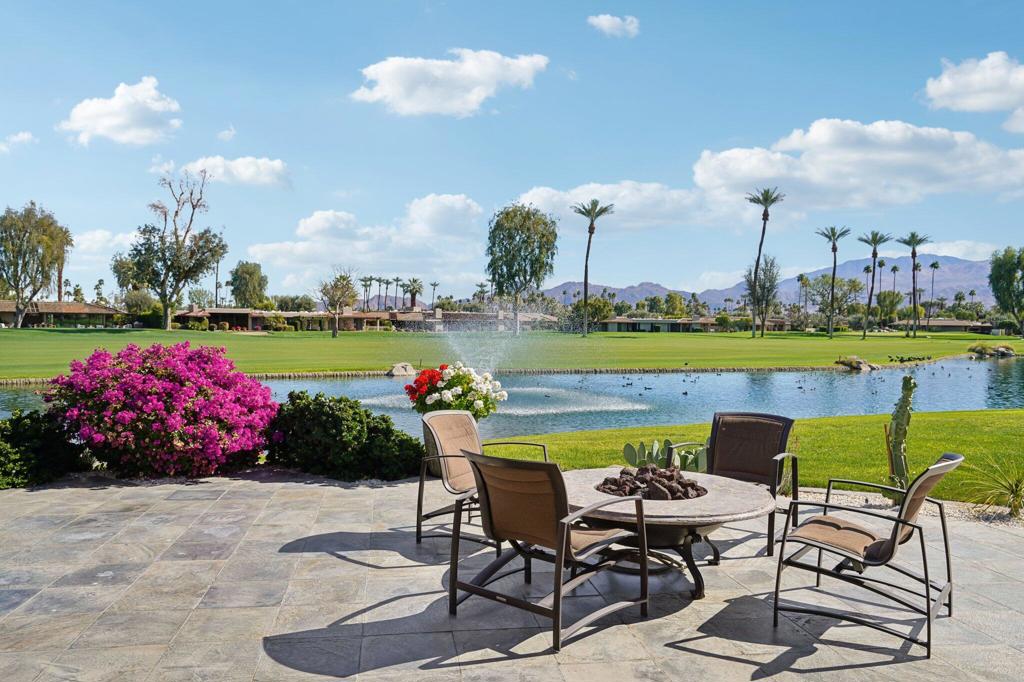 Rarely on the market, this A+ location has exclusive lakefront living at this remarkable residence set within The Springs Country Club. Relax with guests at the end of the day as you admire amazing views over the 16th and 17th fairways towards the commanding Santa Rosa mountains in the distance. The floorplan instantly feels generous in size and opulent, thanks to an expansion of the exterior walls resulting in 3,850 sq ft of light-filled living spaces. Large windows frame the breathtaking outlook, and the three feature fireplaces warm the open-concept layout, ensuring a peaceful ambiance on cool nights. Remodeled kitchen with high-quality appliances, an abundance of Anigre (African hardwood) cabinetry, and high-end fixtures - overlooking the breakfast nook. A family room extends the living space even further, and there is an office and a remodeled laundry room. A spacious primary suite features two walk-in closets, a fireplace, and a luxurious en-suite. Bedroom #2 is currently being used as an office/den. It offers a walk-in closet and shares a Jack-N-Jill bathroom with bedroom #3. All baths have already been tastefully updated. Additional features include double-pane windows throughout, handicap access to the bath, newer air-conditioning units, insulated walls, and a 29-panel owned solar system. This incredible home is set along a tranquil cul-de-sac within a highly sought-after community. An 18-hole golf course, tennis and pickleball facilities, 46 swimming pools, and a fitness center will delight those who want to stay active. The Springs is where you belong!