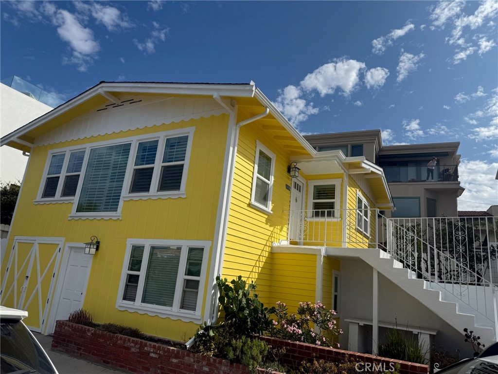 ~OPEN SUNDAY OCTOBER 12, 2025 FROM 2 TO 5 PM~
This is a Classic Beach Cottage just a few short blocks to the Ocean in the desirable North Hermosa Sand Section. It is a Single Family house with a small enclosed yard with some Ocean Views. 2 Bedrooms and 1 Bathroom are in the upstairs area and 1 Bedroom 1 Bathroom are in the downstairs area each have their own entrances. The downstairs area could also be a great office or studio space. 1 small garage and 1 small off street parking area. You can get a permit from the City for year round street parking. The property has just been Freshly painted inside and out. Wood floors throughout have just been refinished. The Livingroom is bright and spacious with a nice fireplace. The Owners have upgraded the windows throughout. A brand new Wall Heater was just installed. There is a separate dining area off the kitchen with sliding glass doors that lead out to a nice enclosed patio/yard. This is a very cute Beach House that is West Facing for those Fabulous Ocean Breezes. The refrigerator and washer dryer are included without warranty.
Sorry No Pets . Tenant(s) pays for all utilities.