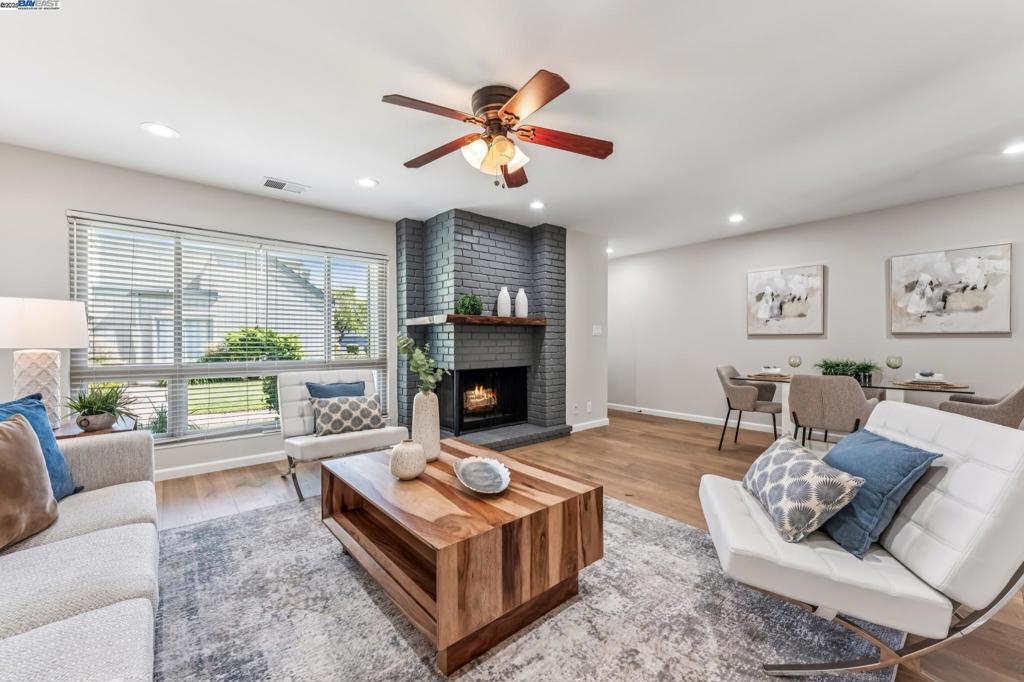 Beautifully updated 4BR/2.5BA townhome in Alameda’s Bay Farm community. This spacious home features engineered hardwood floors throughout, recessed lighting, dual-paned windows, and fresh interior paint. The open living and dining areas are anchored by a custom redwood fireplace mantel, while the eat-in kitchen offers pendant lighting, pantry, counter seating, and newer appliances. A private stamped-concrete patio extends the living space outdoors. Upstairs, the primary suite boasts a remodeled bath with custom tile, waterfall shower, dual-sink vanity, and farmhouse paneling. The guest bath was also fully updated with a soaking tub, new tile, vanity, and fixtures. A remodeled half bath and laundry room with washer/dryer are conveniently located downstairs. Additional highlights include a 2-car garage, new patio screen, and community pool/clubhouse just steps away. Situated across from a greenbelt and close to top-rated schools, parks, shoreline trails, shopping, and the SF ferry — this move-in ready home is a must-see!