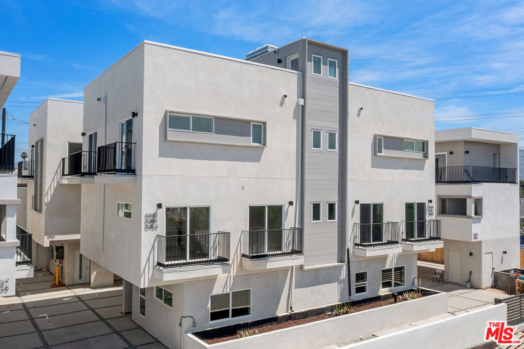 Experience modern luxury living in the heart of North Hollywood! This stunning, newly constructed 3-bedroom, 3.5-bathroom townhouse is part of an exclusive, brand-new 14-unit complex that blends contemporary design with high-end finishes and an unbeatable location.Inside, you'll find an expansive open-concept floor plan with soaring ceilings and an abundance of natural light. The chef's kitchen is equipped with top-tier appliances and premium finishes, while the living and dining areas offer a seamless flow, creating an ideal space for both entertaining and everyday living.The private primary suite is a true retreat, featuring an en-suite bathroom and a spacious walk-in closet. The additional bedrooms are thoughtfully designed and versatile, offering ample space for family, guests, or a home office. The rooftop deck provides the perfect spot to unwind, offering breathtaking views and ample room for outdoor living. This unit also includes in-unit laundry, plenty of storage, and energy-efficient systems for ultimate convenience and comfort. Located just minutes from the vibrant NoHo Arts District, Universal Studios, and an array of dining, shopping, and entertainment options, you'll be at the epicenter of all that North Hollywood and Hollywood have to offer. With two covered parking spaces and easy access to major freeways and public transit, your commute will be a breeze. Don't miss out on the chance to lease this brand-new luxury townhouse in one of L.A.'s most desirable neighborhoods.