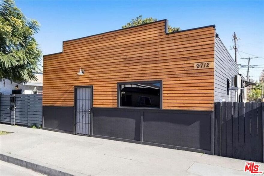 9712 S San Pedro St is a unique offering featuring a mixed use, two unit building. The front is a recently renovated commercial space complete with a kitchen and bath. The rear dwelling unit is also remodeled, featuring 2 bedrooms and 2 baths, in-unit washer/dryer hookups, and a bonus finished basement to round out the space. The property will be delivered with the rear unit occupied. Zoned LAR4, the property may also be suited to further development of additional units, or conversion of the front unit to a dwelling, buyer to make all inquiries. At this price, this property represents a great investment opportunity with remarkable upside potential. Property is sold as-is. Buyer to independently verify square footage, permits, bed/bath count, zoning etc. Please do not disturb tenant in rear unit.