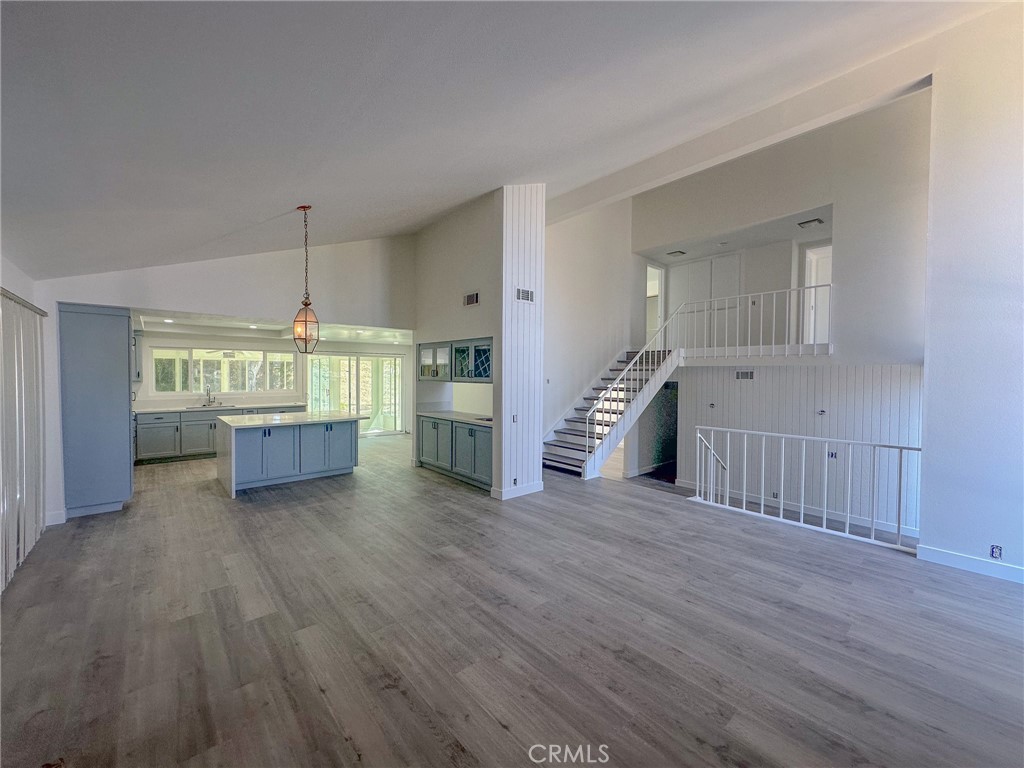 Centrally located in Mission Viejo, the recently remodeled 4 bedroom, 3 bathroom, 2,600 square foot home includes a den and ample space for comfort and relaxation. You'll notice the open floor plan, fresh paint and new flooring the moment you enter. The newly remodeled kitchen opens to the spacious living room which includes vaulted ceilings, a fireplace and wet-bar with built in space for beverages. The gourmet kitchen is equipped with a gas range, microwave, dishwasher, and a generous kitchen island, making it the ideal space for culinary creativity. The kitchen also open to a convenient sunroom expanding usable space within the property. The cozy den features a fireplace and opens to the backyard. Downstairs you'll also find a bedroom adjacent to one of three newly remodeled bathrooms with modern finishes that enhance the overall aesthetic of the home. The interior laundry room is also adjacent downstairs bathroom. Upstairs the primary bedroom is exceptionally spacious with multiple storage options and remodeled ensuite bathroom. The secondary bedroom each include a slider to the deck over the garage which the remodeled hall bath includes a large tub and dual vanity. Rent includes paid gardening service ensuring more time to enjoy the large lot. Contact us today to schedule your showing!