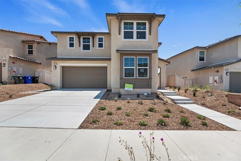 This home does it all with its flowing great room, kitchen, dining plus first-floor bedroom and full bath. Extra points for the roomy loft on the second floor and covered deck off the primary suite.
White shaker-style cabinets and light gray quartz counters meet at coordinating tile backsplash in the kitchen
Neutral-hued luxury vinyl plank flooring covers the main living area; light carpet, in a subtle pattern, covers bedroom floors
White tile in the primary’s spa shower feels crisp and clean