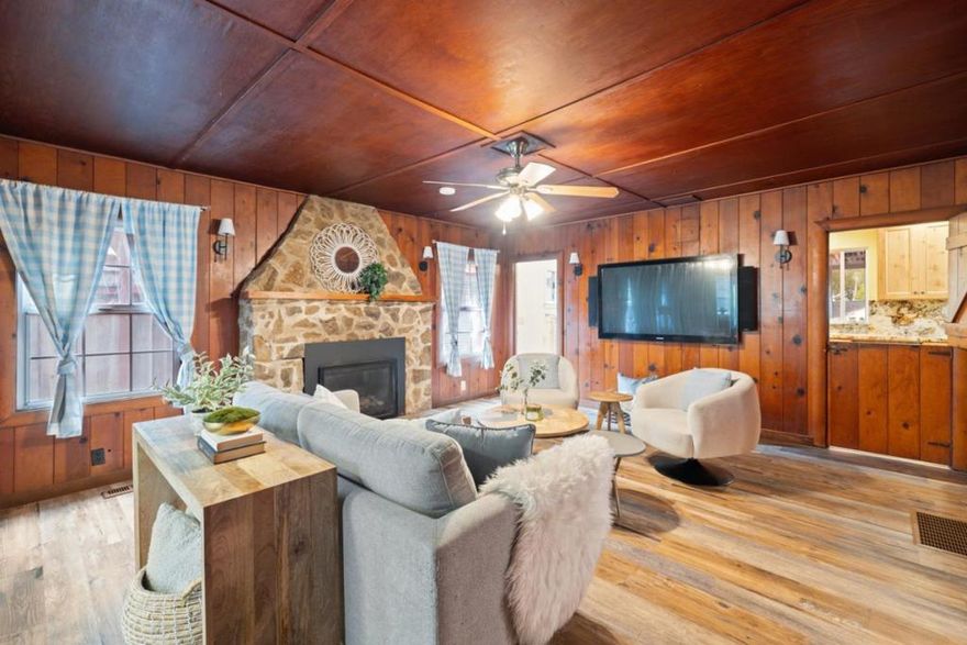 SINGLE STORY LIVING with gated entry!! Come home to a flat, easy-to-drive neighborhood, surrounded by the majestic redwoods... full of sun as well as natural beauty. This home has a classic cabin ambience with beautiful wood paneling and a gas-burning rock fireplace, you will feel like you are on vacation all year long! There is also central heat. The custom kitchen has been remodeled with granite countertops, high end appliances and gorgeous custom cabinets. Plus a dutch door to keep the dog out while you are cooking up a storm! A breakfast nook opens up onto a covered patio that overlooks the fenced in yard. Entertain year round with a built-in mini fridge and connections for an outdoor TV, as well as a flexible garden area. Extra storage with the detached garage AND basement. The BIG bonus is the fully automatic whole house generator that is included for peace of mind.  Just minutes to Miller County Park, Garrahan Park and Downtown Boulder Creek. Great location for commuters, less than 30 miles to Silicon Valley via Highway 9 or Bear Creek Rd, and ~15 miles to the beautiful beaches along the Santa Cruz coast.
