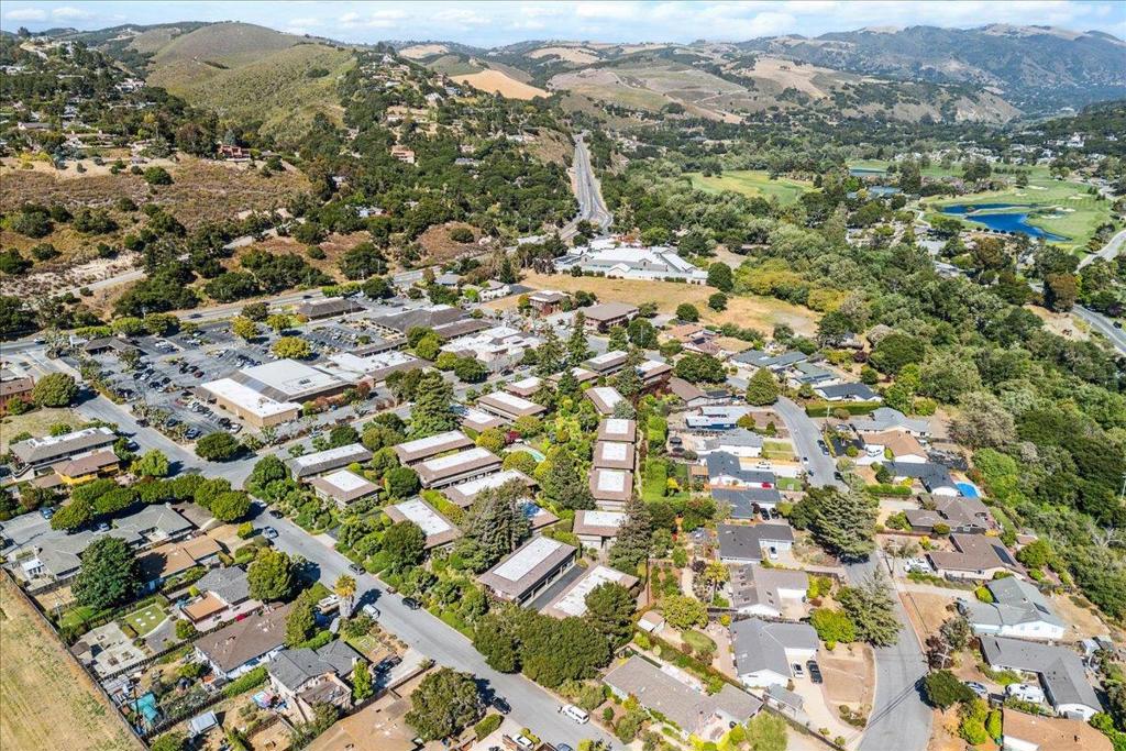 Set within one of Mid Valleys most sought-after communities, this second level corner unit presents a wonderful opportunity for anyone seeking to enjoy the Carmel Valley lifestyle. This unit is perfectly situated within beautifully landscaped grounds, offering peaceful mountain views from your private balcony. Inside, the two spacious ensuite bedrooms and inviting living room provide comfort and flexibility. Begin your day with a cup of coffee in serenity, or wind down by the cozy fireplace in the evening. Modern touches include LED lighting with dimmers, a new furnace and water heater installed in 2022, and updated flooring, lighting and vanities in the bathrooms. Just steps away, enjoy the community pool, along with a dedicated carport and generous storage closet. A short stroll brings you to Mid-Valley Shopping Center with a revived laundromat, Safeway, dining, and other essential businesses. Access to the acclaimed Carmel Unified School District further adds to the appeal of this property. Whether you are looking for a primary home, rental investment, or weekend escape, this is a chance not to be missed.