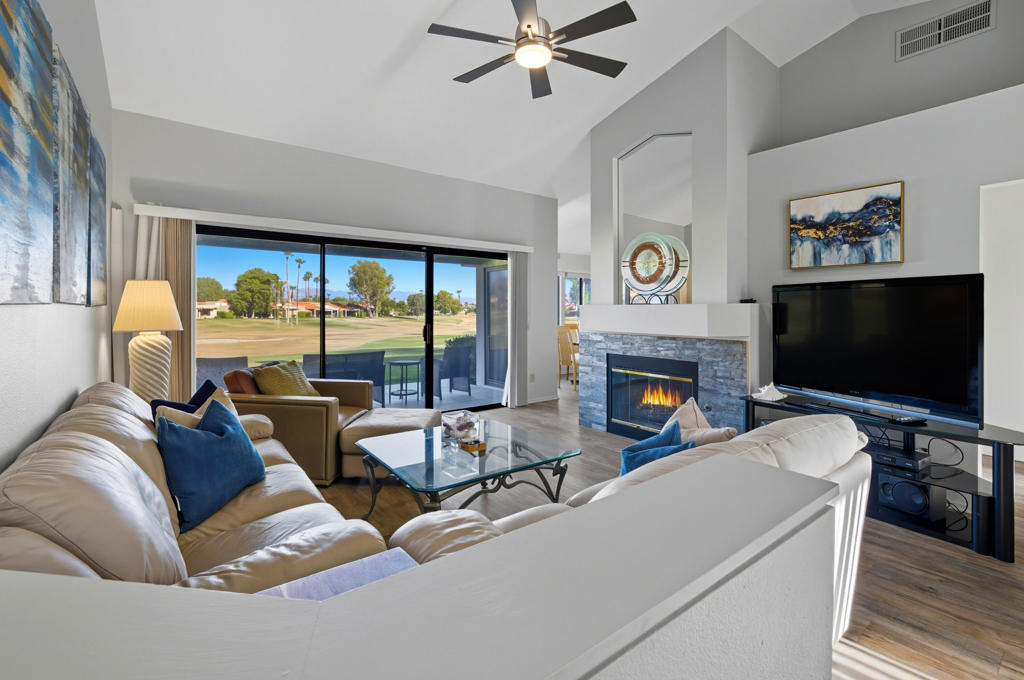 This popular Classic floorplan is nicely updated with 2 bed, 2 bath,1245 sq. ft. and is move-in ready. Located on the 2nd hole of the Palm Desert Resort Country Club. Whether you're looking for a full-time home, seasonal retreat, or investment property, this one checks all the boxes! Step inside to a bright and open floor plan with easy-care vinyl plank flooring throughout and a tile-lined fireplace in the spacious living area. A large sliding glass door leads out to the rear patio, offering gorgeous panoramic golf course views and plenty of space to relax, dine, or entertain outdoors. The kitchen has been tastefully updated with modern countertops, a deep stainless steel sink, and fresh cabinetry. There's also a dining area just off the kitchen, giving you lots of room for entertaining and meals with family and friends. The primary suite is a true highlight, featuring double-door entry for added privacy, a private slider to the backyard, a large soaking tub, dual sinks, and a generously sized walk-in closet. The guest bedroom is perfect for visitors and connects to a Jack-and-Jill bathroom, offering both privacy and convenience. You'll also appreciate the indoor laundry area. This home is part of the Palm Desert Resort Country Club, a welcoming community with access to golf, tennis, pools, spas, and a clubhouse -- all in a beautifully maintained setting. The location is ideal too, just minutes from shopping, dining, entertainment, and world-class events like the BNP Paribas Open and Coachella. If you're dreaming of desert sunsets, peaceful mornings on the patio, and a low-maintenance home in a vibrant community -- this is it. Come take a look and see why this condo is the perfect fit for your next chapter.