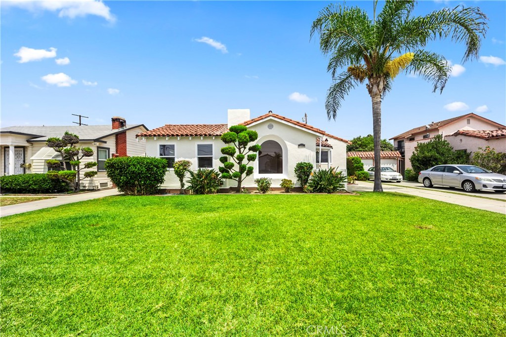 This absolutely gorgeously remodeled Spanish-style single-family home has been fully modernized to blend vintage character with modern amenities. With 3+BONUS bedrooms, it’s perfect for large families, or even two families. Located in the prestigious area of Walnut Park in the heart of Huntington Park, the property features a south-facing living room with a large arched window that allows plenty of natural light to flood in. The kitchen includes new appliances, a breakfast nook, and a separate laundry area with washer and dryer hookups. The bathrooms have been tastefully updated, and the primary bathroom features both a bathtub and a separate shower. There’s a very spacious family room/den/office/entertaining space that can be used as an ultra-large 4th bedroom if needed. The formal dining room is ideal for family dinners. The home also includes a basement with a water heater and extra storage space, and a fireplace. Outside, the property boasts new landscaping, fruits trees such as apples, figs, oranges, tangerines, and lemon and a clean, freshly painted garage with sealed floors that could potentially be converted into an ADU easily, and plenty of parking, with a driveway that can accommodate up to 5 vehicles, plus 2 more inside the garage and 2 additional spaces on the street. Located near top-rated schools, this home is perfect for large families and offers a beautiful blend of classic charm and modern convenience. Don’t miss the opportunity to own this exquisite piece of Huntington Park.