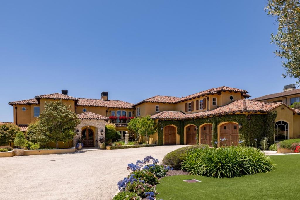 Welcome home to the lap of luxury and the comforts of home. This inspiring residence within the gates of The Club at Pasadera is instantly appealing and a picturesque treasure, located off the 12th fairway of the Jack Nicklaus signature golf course with views of it all. Five bedroom suites, 6 baths and a large media/theatre that will tempt you to watch the latest and greatest movies snuggled at home. The gorgeous wine cellar might be the first stop on the way to the theatre for a rare vintage or start in the separate breakfast room for a treat from the extra built in's and grab a coffee to bring with you. That is of course if you can draw yourself away from the roaring fire in the breakfast room! Hard choices to make? There are many patios with a "secret garden" feel that are well appointed and great spots to watch the gorgeous sunsets over the hills and fairways. Or, get some woodworking done in the workshop area off the 3 car large garage with a bay for your golf cart. Maybe grab the golf cart and go for a drive to the club or play a few holes! Like a picture book, this is a home that is a joy to live in and a home that memories are made in. Come and see for yourself and live the way you'd like to live in a home with a warm heart that is definitely an escape from the ordinary!