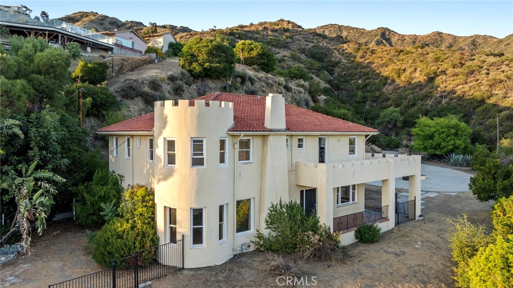 New price! New Price! new price!! Panoramic Views! Views!. Charming Mediterranean with unobstructed views, lots of privacy and seclusion on a11.o+acres.
Excellent Burbank Hills location' Home features Extra-large living room w/hardwood floor, fireplace, step down formal dining room, six bedrooms, three bathrooms, good size kitchen with granite countertop, California basement ideal for storage or extra workspace.
two bedrooms and one full bath on the first floor, two staircases leading to the second floor. One laundry hook-up in the kitchen and another one in the second basement.
Upstairs you will find a massive Master suite with a full bath and large deck with 360-degree views, hardwood floors and two secondary bedrooms and one bath.
This is a unique property with lots of potential, home need lots of love and lots of work to make it livable and enjoyable.
Easy to show.