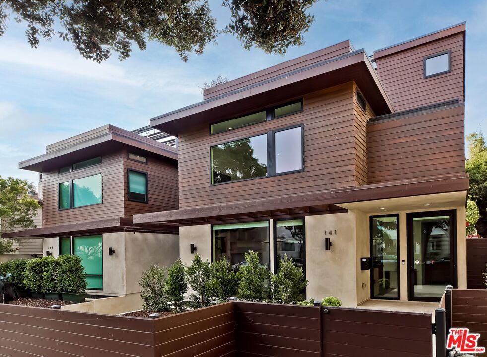 Steps from Prime Santa Monica Beach. Stunning modern home, available now. On-site parking for 3+ cars. State-of-the-art masterpiece. A total of 5 BR openfloor plan allows an easy flow from Great Room to formal dining to magnificent entertainer's kitchen that includes top tier Wolf and Subzero appliances and over-sized island. The kitchen opens to the sophisticated and drought-resistant landscaped backyard with high end BBQ Counter. Sliding pocket doors open completely to an outdoor side deck dining area, ideal for parties al fresco. The ground floors also has an en-suite bedroom and powder room. Downstairs features a guest room, laundry room, gym/media room, kitchenette, an enormous storage room for bikes and surfboards. Second floors with 3 en suite bedrooms + laundry rm. Luxe master has treetop views, walk-in closet and 5-star bath. Huge rooftop deck with fire pit and ocean view hot tub. A must see!